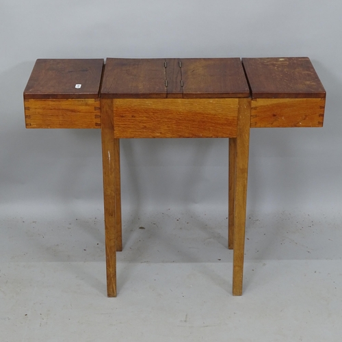 2170 - An early 20th century oak sewing table, having 3 compartments with lifting lids, 71cm x 58cm x 26cm