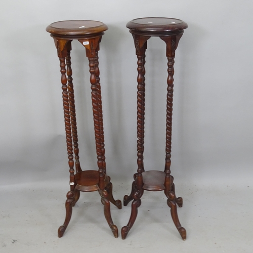 2172 - A matched pair of mahogany torchers, tallest 100cm