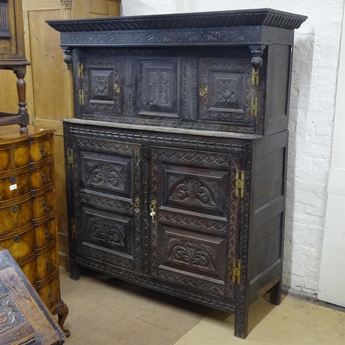 2174 - An Antique oak 2-section court cupboard, with chip carved decoration, on stile legs, 145cm x 186cm x... 