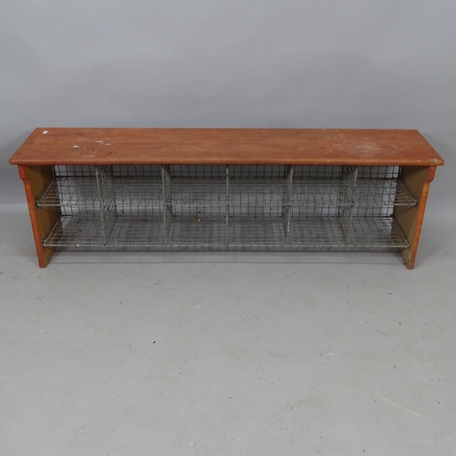 2176 - A teak and mesh bank of 12 pigeon holes, 137cm x 43cm x 31cm