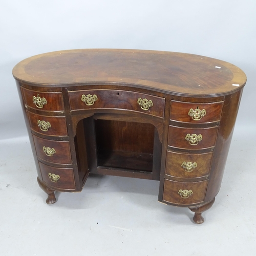 2184 - An Edwardian cross-banded mahogany kidney-shaped writing desk, with 9 fitted drawers and cupboard un... 