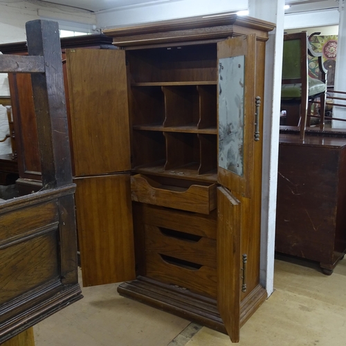 2188 - A Spanish oak 4-door armoire, the interior fitted with 4 drawers and shelved compartments, 99cm x 19... 