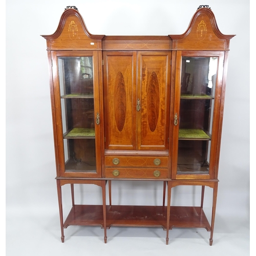 2001 - A 19th century mahogany inverted break-front cabinet on stand in 2 sections, 141cm x 195cm x 43cm