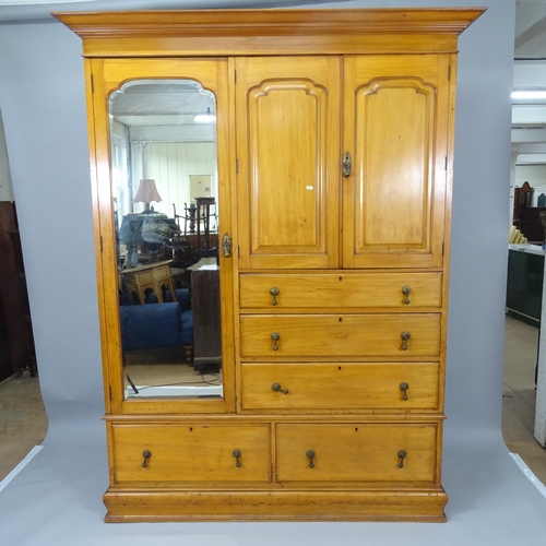 2004 - An Edwardian ash Beaconsfield  wardrobe in 4 sections, comprising a mirrored cupboard section adjace... 