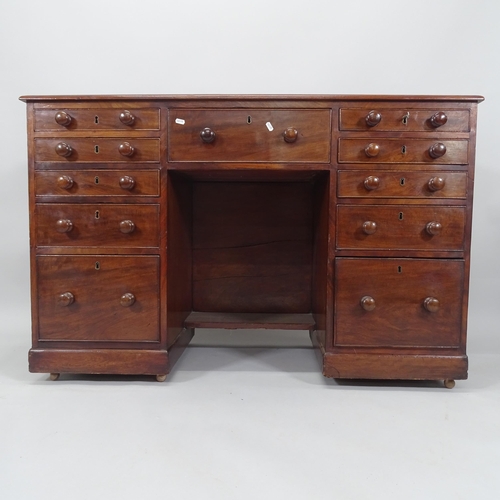 2006 - A 19th century mahogany kneehole writing desk, with 11 fitted drawers, 130cm x 85cm x 53cm (with key... 