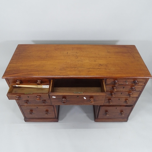 2006 - A 19th century mahogany kneehole writing desk, with 11 fitted drawers, 130cm x 85cm x 53cm (with key... 