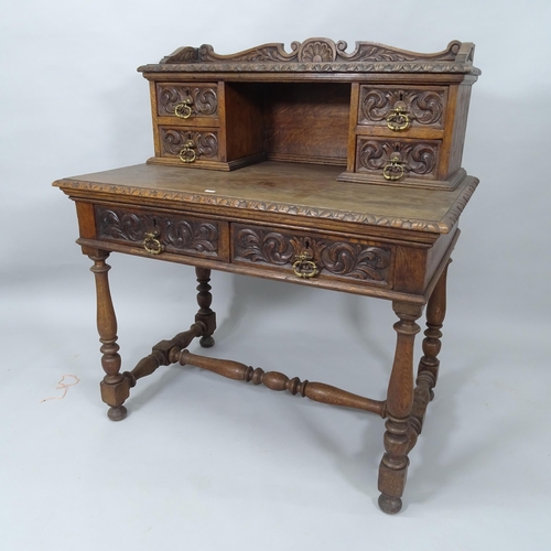 2008 - A Victorian carved oak writing table, with raised back and 6 fitted drawers, with H-shaped stretcher... 