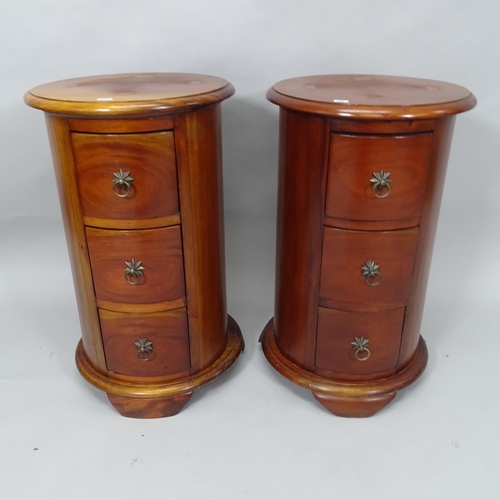 2010 - A pair of hardwood drum-shaped 3-drawer bedside chests, 41cm x 67cm