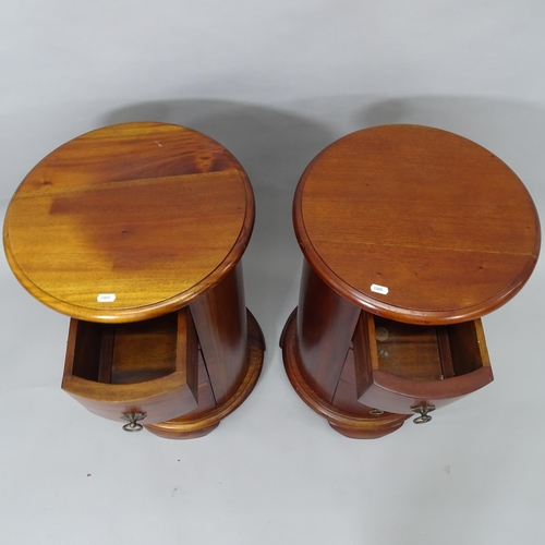 2010 - A pair of hardwood drum-shaped 3-drawer bedside chests, 41cm x 67cm