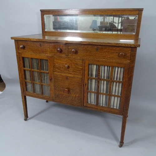 2016 - R J Horner, an American Arts and Crafts Mission sideboard, with glazed doors and mirror-back in tige... 