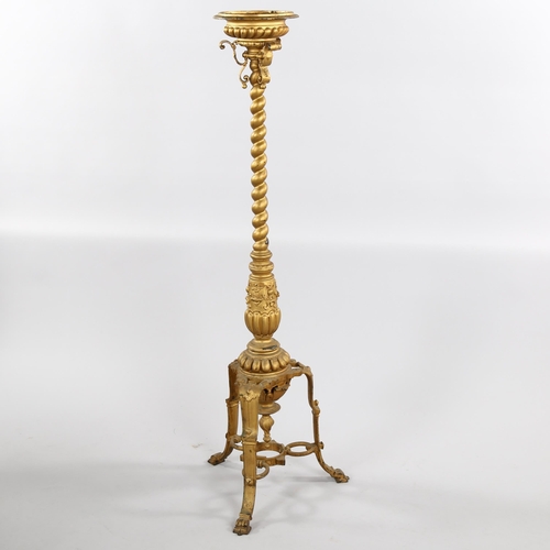 2027 - A 19th century cast bronze torcher stand, with spiral twist centre column and tripod base, height 12... 