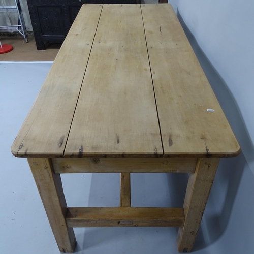 2028 - An Antique pine plank-top dining table, with H-shaped stretcher, 182cm x 76cm x 75cm