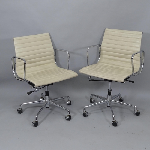 2029 - A pair of Sam Hongsa ribbed swivel office chairs, upholstered in white faux leather, on chromed base