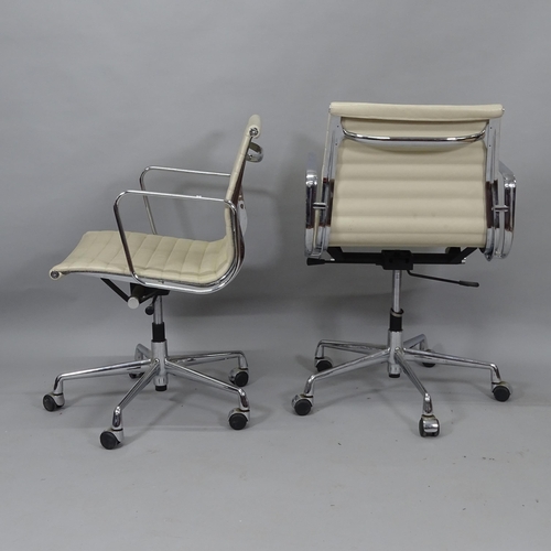 2029 - A pair of Sam Hongsa ribbed swivel office chairs, upholstered in white faux leather, on chromed base