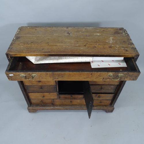 2035 - An Antique stained pine bank of 16 drawers, with single central cabinet, on bracket feet, 92cm x 88c... 