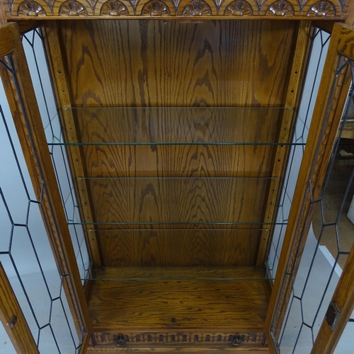 2036 - A JC Furniture oak bookcase, with leadlight glazed doors, adjustable glass shelves with drawer under... 