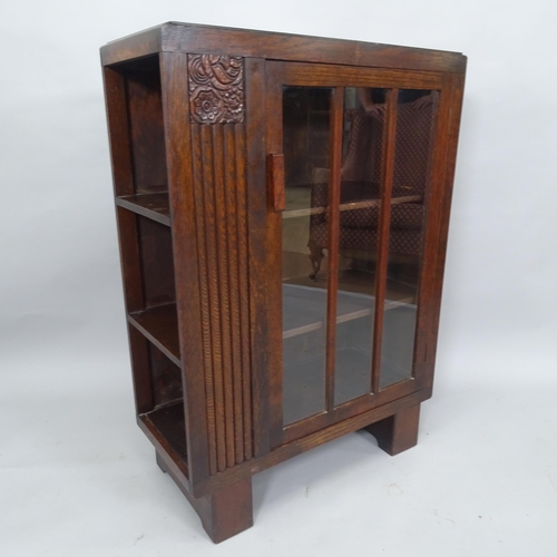 2038 - An Arts and Crafts oak cabinet with single-glazed door, and shelf-fitted side, 69cm x 97cm x 32cm