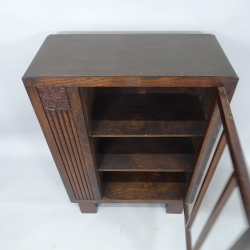 2038 - An Arts and Crafts oak cabinet with single-glazed door, and shelf-fitted side, 69cm x 97cm x 32cm