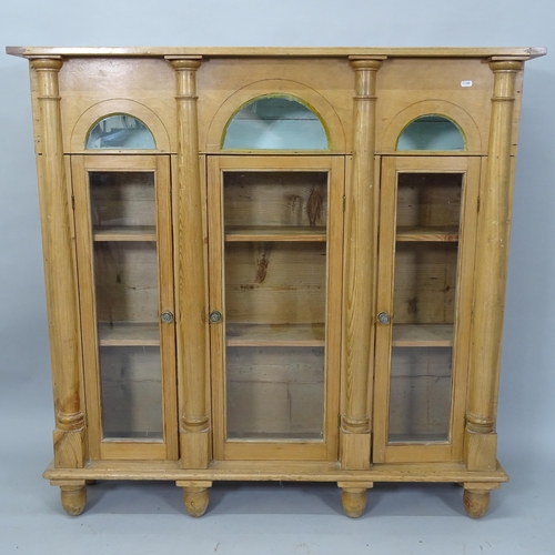 2042 - An Antique pine 3-door bookcase/display cabinet, with lifting top and 3 glazed panelled doors, 121cm... 