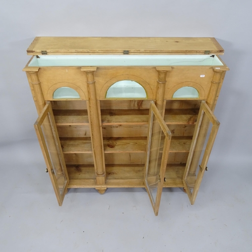 2042 - An Antique pine 3-door bookcase/display cabinet, with lifting top and 3 glazed panelled doors, 121cm... 