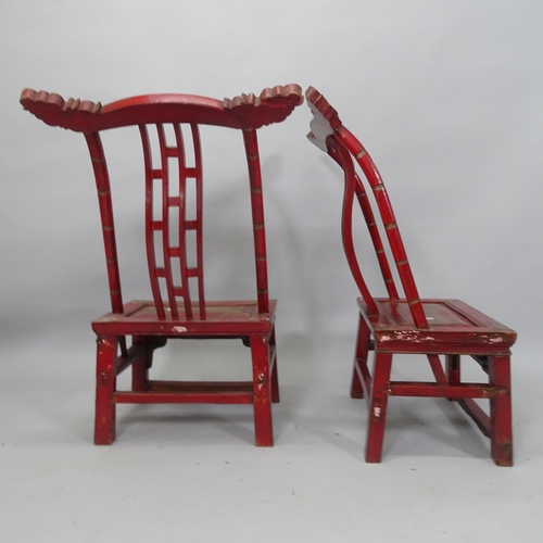 2044 - A pair of Chinese elm chairs, with carved and lacquered decoration