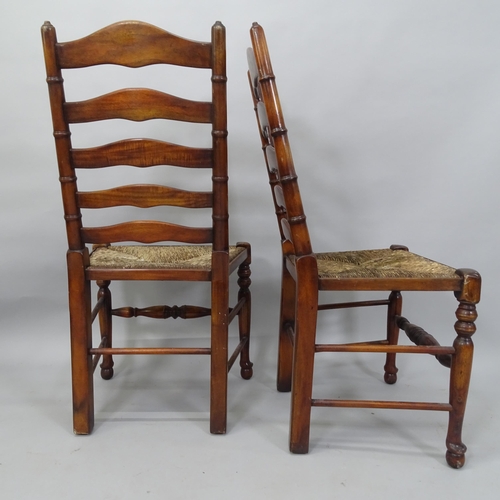 2051 - A set of 4 reproduction rush-seated ladder-back dining chairs. H - 103cm, Seat H - 48cm, W - 54cm to... 