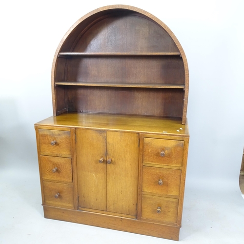 2063 - Attributed to Ambrose Heal for Heal & Son, an early 20th century oak dresser, with raised dome-top p... 