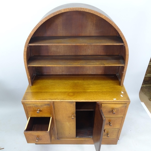 2063 - Attributed to Ambrose Heal for Heal & Son, an early 20th century oak dresser, with raised dome-top p... 