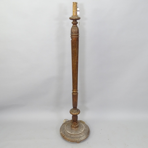 2065 - An Antique mahogany standard lamp, with fluted column and carved decoration, H150cm