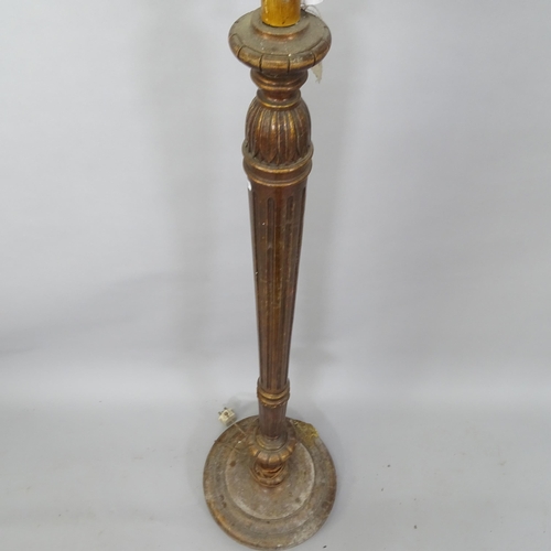 2065 - An Antique mahogany standard lamp, with fluted column and carved decoration, H150cm