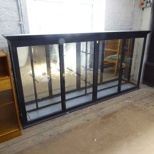 2080 - An ebonised display cabinet, with mirror-back and 4 glazed panelled doors, 245cm x 123cm x 36cm (wit... 