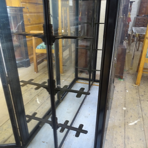 2080 - An ebonised display cabinet, with mirror-back and 4 glazed panelled doors, 245cm x 123cm x 36cm (wit... 