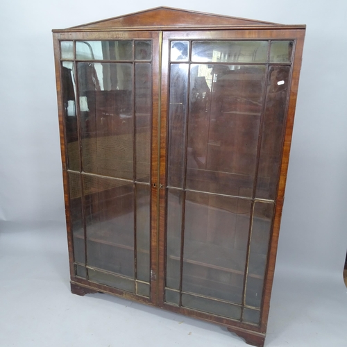 2086 - A 1930s mahogany bookcase, with 2 lattice-glazed doors on bracket feet, 123cm x 166cm x 27cm (with k... 