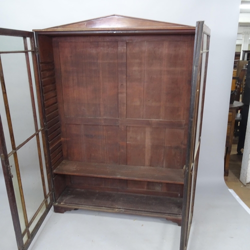 2086 - A 1930s mahogany bookcase, with 2 lattice-glazed doors on bracket feet, 123cm x 166cm x 27cm (with k... 