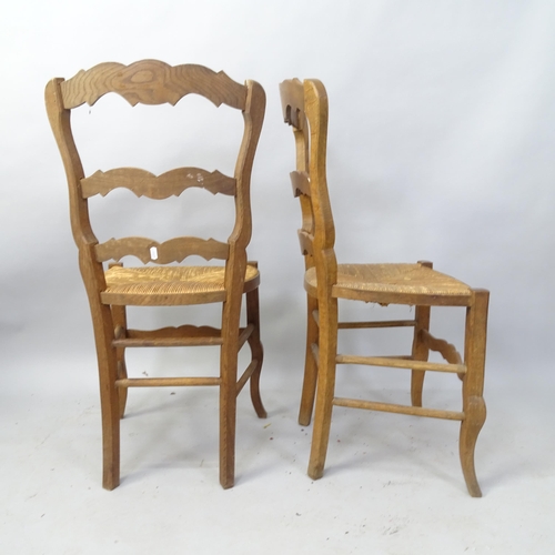 2094 - A set of 6 French oak rush-seated ladder-back dining chairs