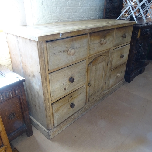 2097 - An Antique pine sideboard, having 7 fitted drawers and cupboard under, 156cm x 98cm x 56cm