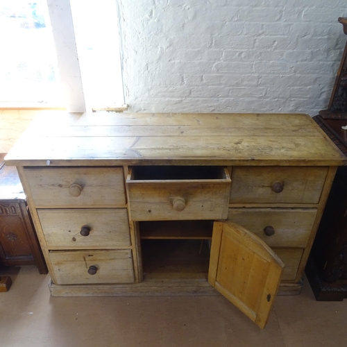 2097 - An Antique pine sideboard, having 7 fitted drawers and cupboard under, 156cm x 98cm x 56cm