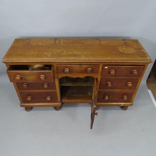 2098 - An Antique mahogany sideboard, having 7 fitted drawers, single cupboard under, on turned legs, 153cm... 