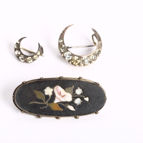 1060 - A silver and Pietra Dura brooch of oval form, and 2 silver and paste set crescent design brooches (3... 