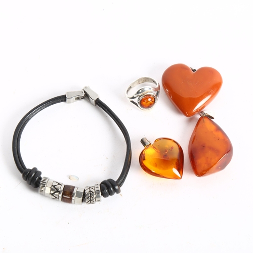 1063 - 3 amber pendants, and a silver and amber mounted ring, charm bracelet etc