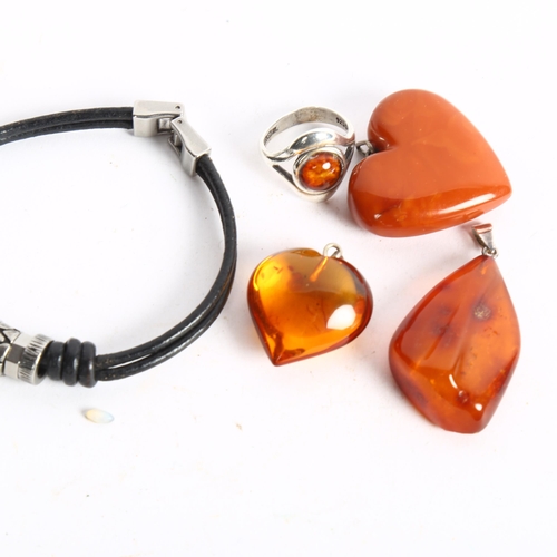 1063 - 3 amber pendants, and a silver and amber mounted ring, charm bracelet etc