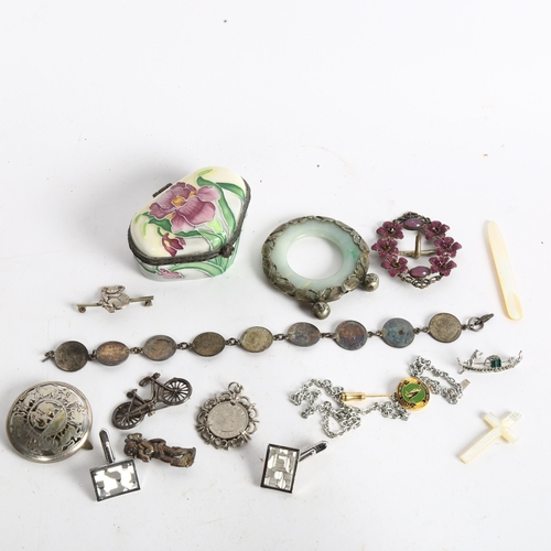 1065 - A jade and white metal mounted pendant, a floral and enamel buckle, three penny bit coin bracelet et... 