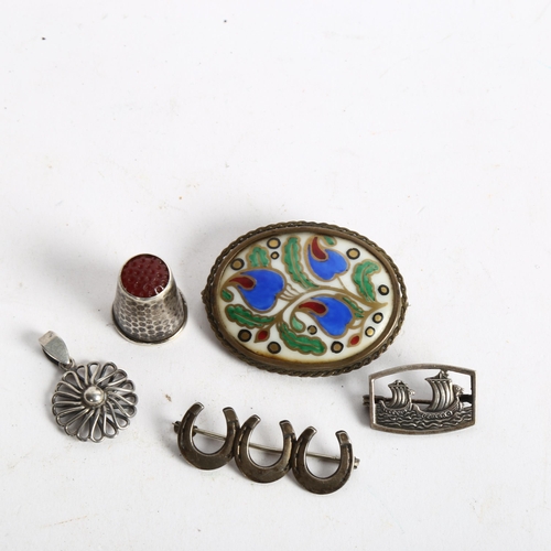 1080 - A porcelain and painted brooch in silver mount, horse shoe design brooch, thimble etc