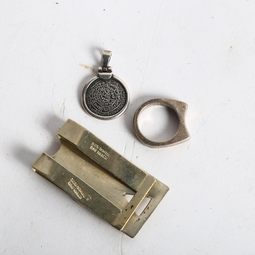 1082 - TAXCO - a Mexican sterling silver money clip, Mexican ring, and a pendant (3)