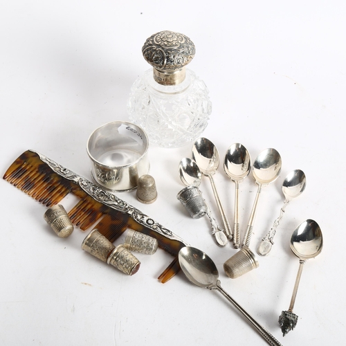 1095 - A group of silver and plated items, to include 7 silver thimbles, an embossed silver-topped dressing... 