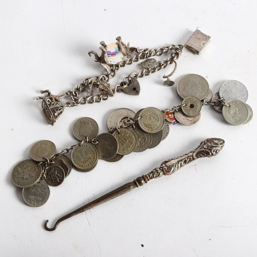 1099 - A Continental coin bracelet, a silver charm bracelet, and silver-handled button hook