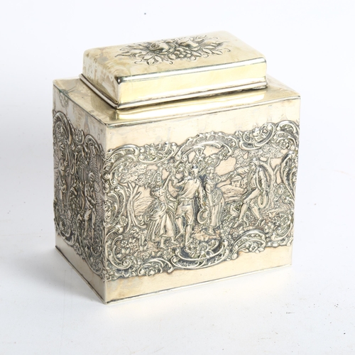 1103 - A decorative silver plated tea caddy, with embossed dancing figure decoration