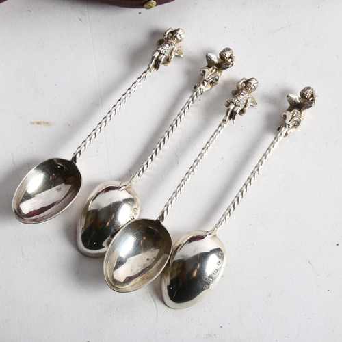 1105 - A cased set of early 20th century silver plated teaspoons, with cherub finials and spiral handles, m... 