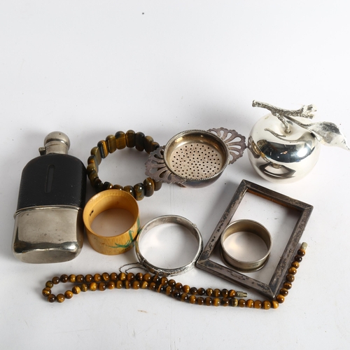 1106 - A tray of sliver and jewellery, to include silver-fronted frame, hip flask, agate bracelet, tigers e... 