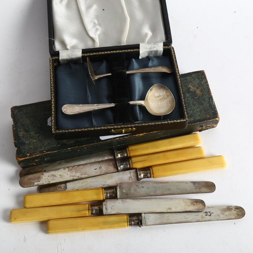 1108 - A cased set of 6 Continental silver-bladed knives, and a child's silver spoon and pusher set, boxed